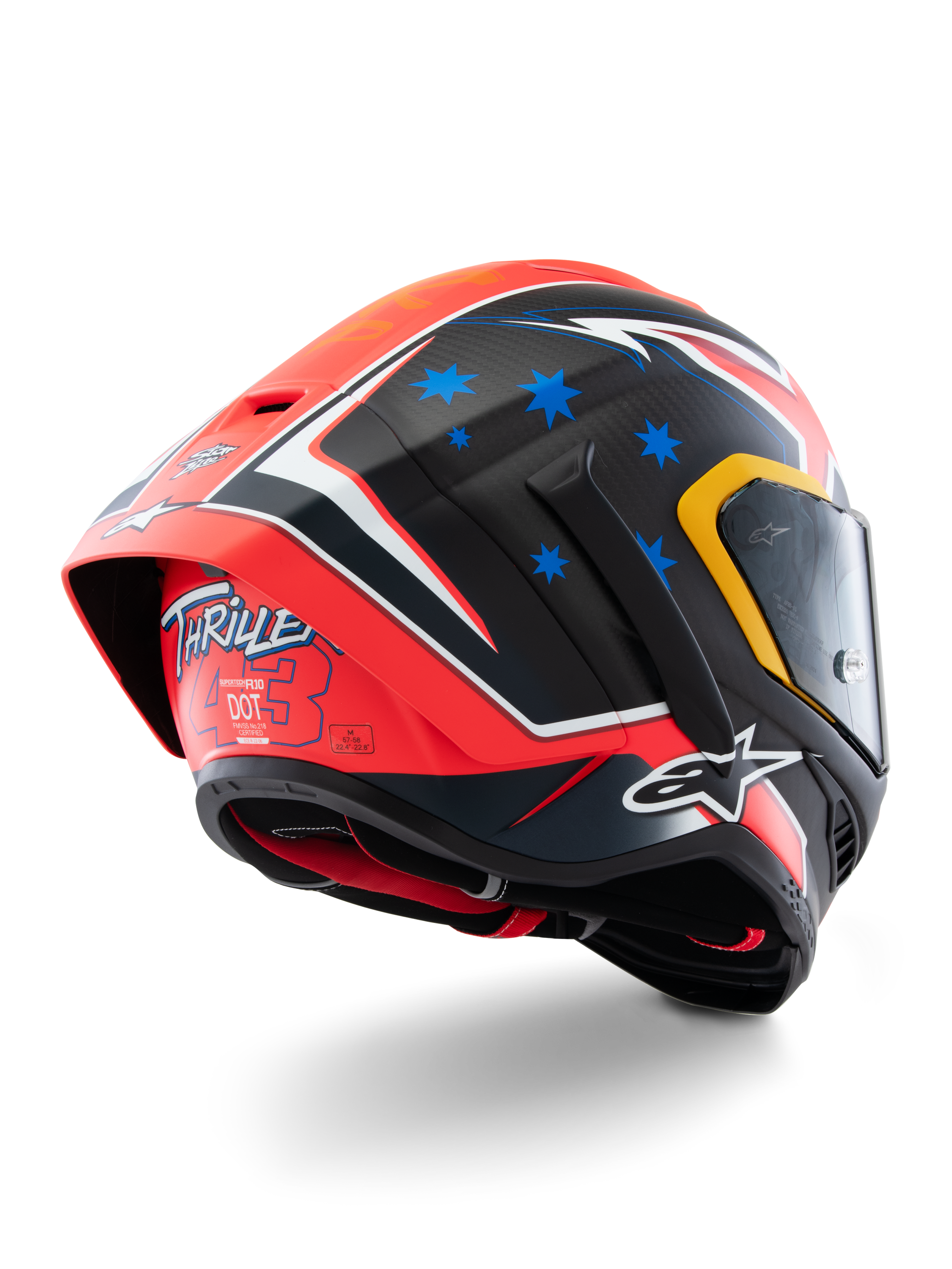 Capacete Alpinestars Supertech R10 Miller Limited Edition, capacete de corrida integral, Carbon Red Matt com estrelas azuis e detalhes brancos, grafismo 'Thriller 43' na parte traseira, spoiler aerodinâmico de grandes dimensões, construção em fibra de carbono