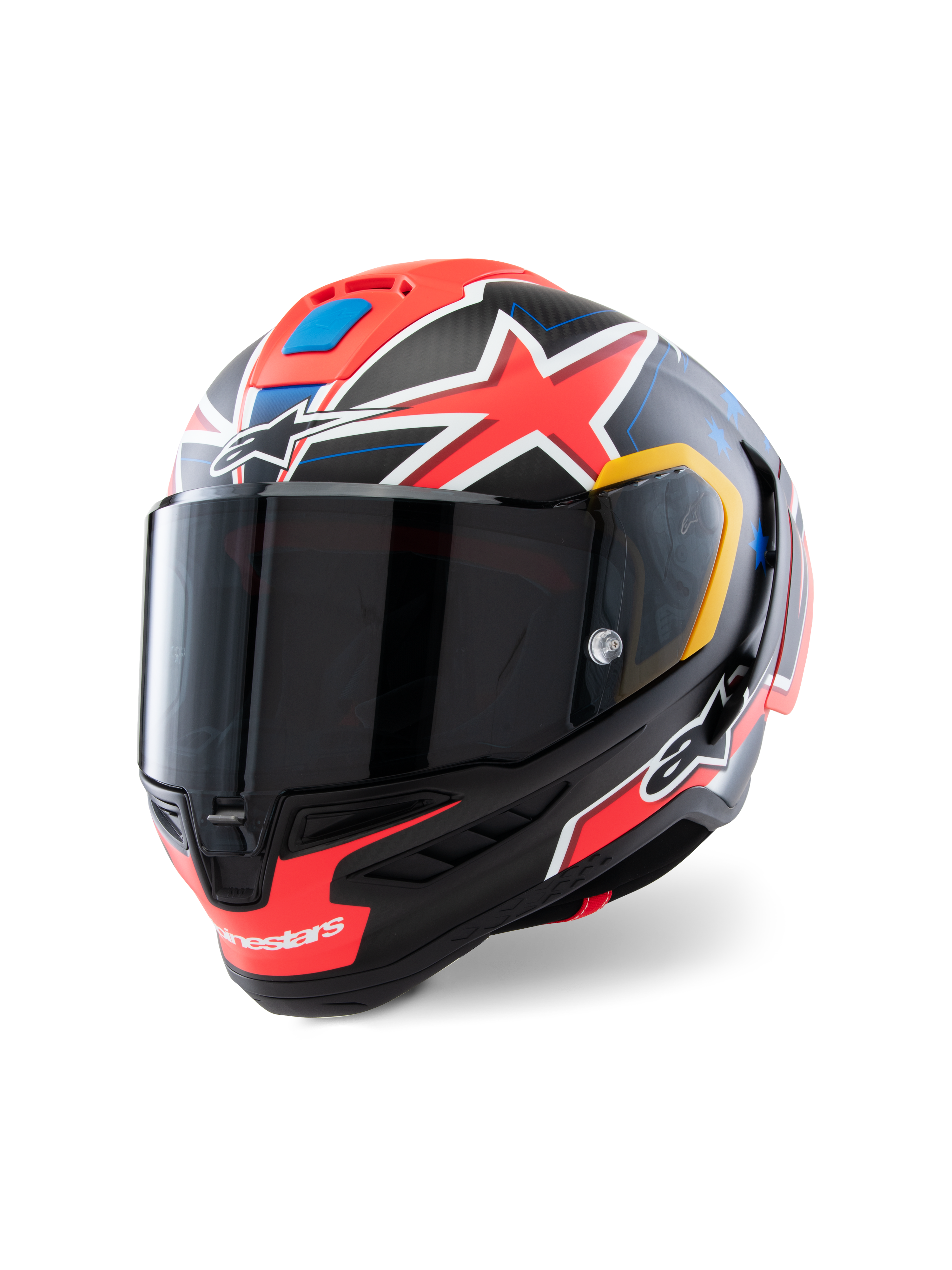 Capacete Alpinestars Supertech R10 Miller Limited Edition, capacete integral de corrida, Carbon Red Matt com estrelas vermelhas, pormenores gráficos azuis e amarelos, viseira fumada escura, calota aerodinâmica em carbono para motociclismo profissional
