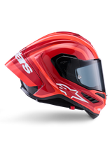 Capacete Alpinestars Supertech R10 Arius, capacete de corrida integral, vermelho e laranja brilhante, vista de perfil lateral com um spoiler traseiro aerodinâmico, logótipo Astars branco na queixeira e viseira transparente, concebido para desempenho de alta velocidade em pista