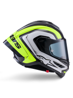 Capacete Alpinestars Supertech R10 Arius, capacete integral de corrida, preto, prateado e amarelo fluorescente brilhante, vista de perfil lateral mostrando o casco aerodinâmico e a viseira fumada escura, construção em fibra de carbono com logótipos em destaque