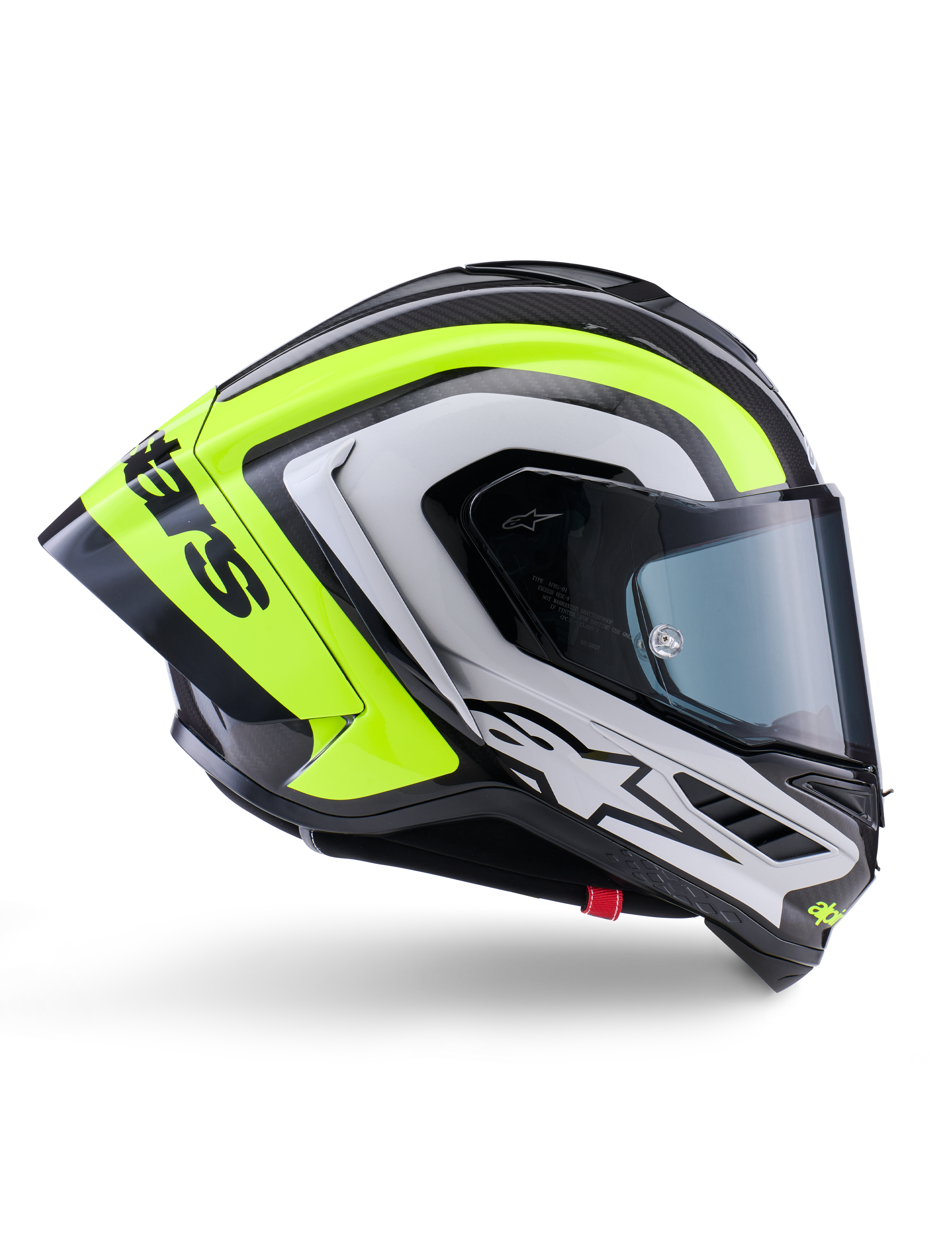 Capacete Alpinestars Supertech R10 Arius, capacete integral de corrida, preto, prateado e amarelo fluorescente brilhante, vista de perfil lateral mostrando o casco aerodinâmico e a viseira fumada escura, construção em fibra de carbono com logótipos em destaque