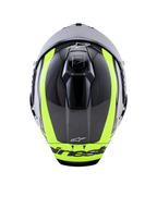 Capacete Alpinestars Supertech R10 Arius, vista superior, em preto, prata e amarelo fluorescente brilhante, casco em fibra de carbono com riscas amarelas fluorescentes vibrantes, aberturas de ventilação superiores aerodinâmicas e marca Alpinestars, capacete de competição de alta performance