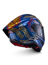 Alpinestars Supertech R10 Martinator Thai Helmet in glossy blue with gold mandala patterns and a rear spoiler.