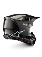 Alpinestars Supertech M10 Solid Helmet ECE 22.06, black glossy carbon motocross helmet, side view with carbon shell, ventilation ports and peak visor, ECE certified