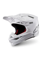 Alpinestars Supertech M10 Solid Helmet ECE 22.06, glossy white motocross helmet with black and red interior padding, peak visor and multiple ventilation ports, three-quarter product view