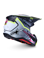 Capacete Alpinestars S-M7 Blaster ECE06, capacete de motocross preto, cinzento e branco com detalhes em amarelo fluorescente e rosa.