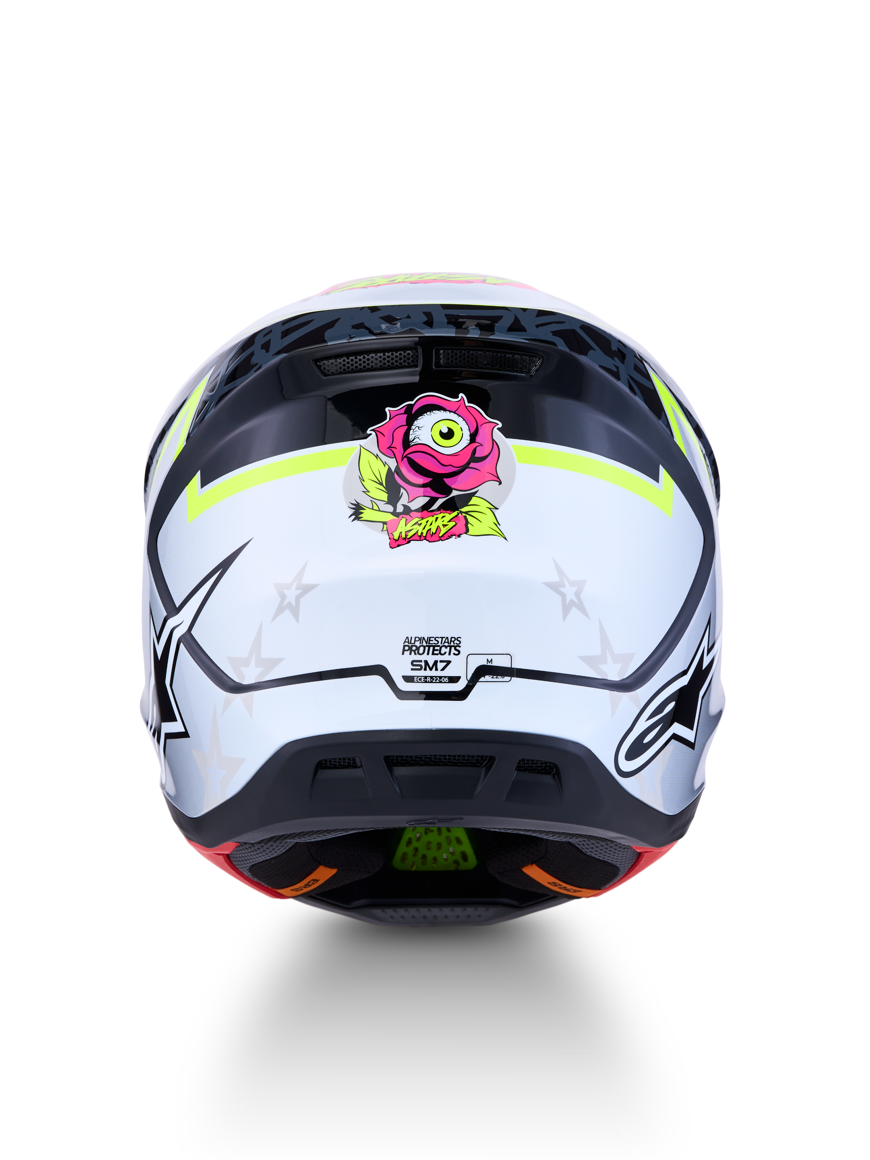 Capacete Alpinestars S-M7 Blaster todo-o-terreno, vista traseira, branco e preto com pormenores amarelos e rosa, certificado ECE
