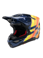 Capacete Alpinestars Supertech M10 TLD Edition 25, capacete de motocross, azul escuro brilhante com gráficos laranja e amarelo néon, com forro interior vermelho, calota aerodinâmica com múltiplas aberturas de ventilação, marca Troy Lee Designs na pala, equipamento profissional de competição off-road