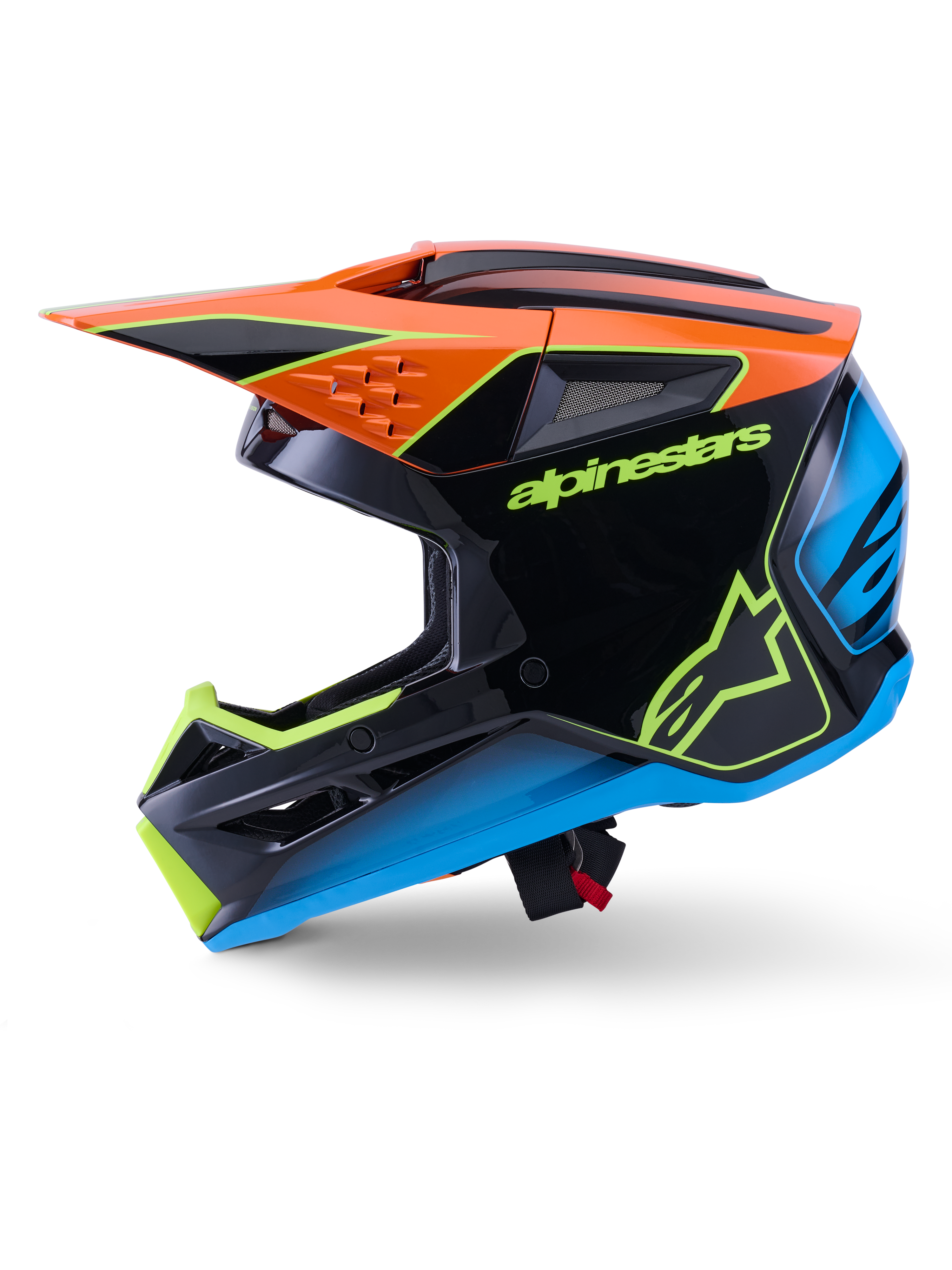 Capacete Alpinestars S-M3 Fray ECE 22.06, capacete de motocross, preto com detalhes em cor de laranja, azul e amarelo fluorescente, vista de perfil lateral exibindo a calote aerodinâmica e aberturas de ventilação integradas, com logótipos Alpinestars em destaque, proteção profissional para corridas todo-o-terreno