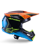Capacete Alpinestars S-M3 Fray ECE 22.06, capacete de motocross, preto, laranja, azul e amarelo néon, perfil lateral de uma calota aerodinâmica brilhante com uma pala laranja proeminente, logótipo em verde néon e detalhes em azul, proteção para competição todo-o-terreno