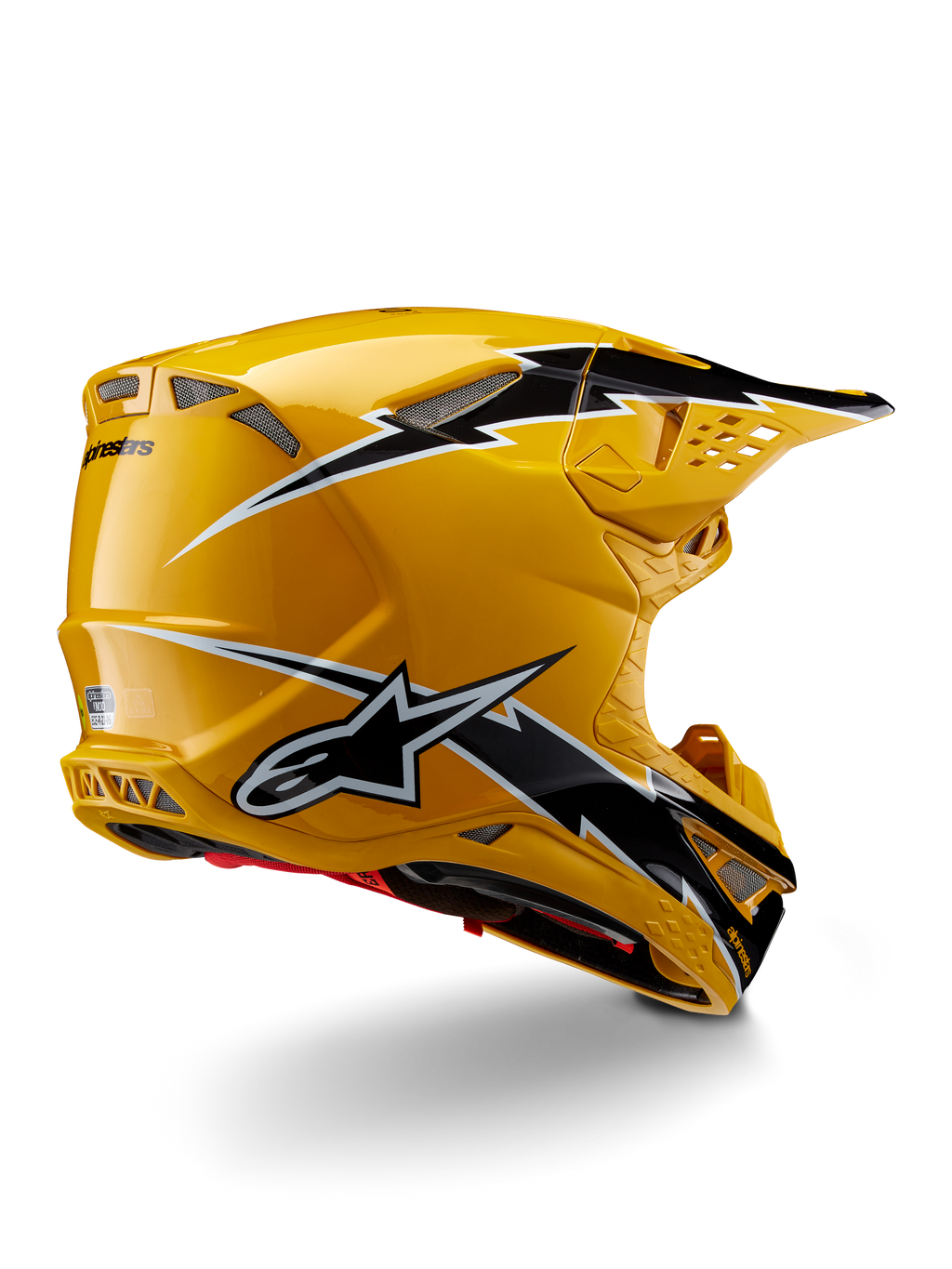 Capacete Alpinestars Supertech M10 Ampress, capacete de motocross, preto e amarelo brilhante, com acabamento amarelo de alto brilho e gráficos em estilo de relâmpago pretos e brancos, vista traseira de três quartos mostrando a calota aerodinâmica e entradas de ventilação integradas.