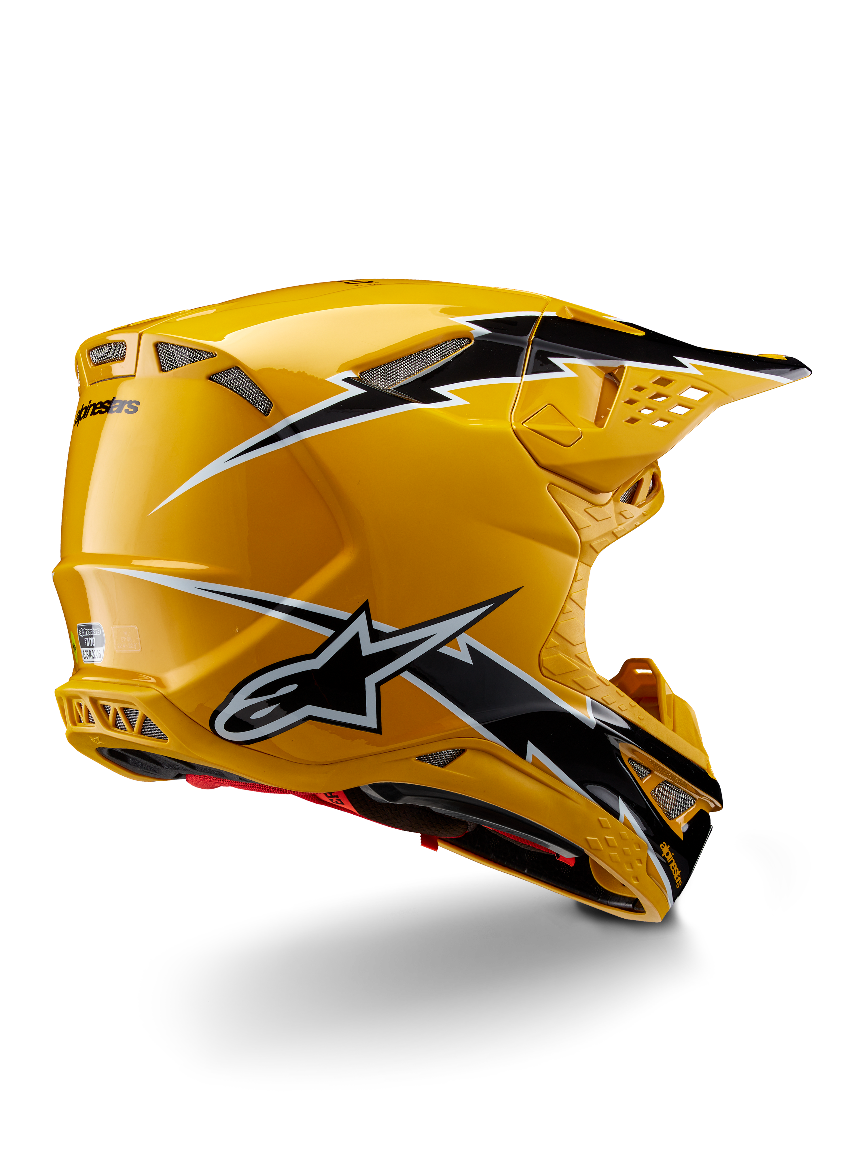 Capacete Alpinestars Supertech M10 Ampress, capacete de motocross, preto e amarelo brilhante, com acabamento amarelo de alto brilho e gráficos em estilo de relâmpago pretos e brancos, vista traseira de três quartos mostrando a calota aerodinâmica e entradas de ventilação integradas.
