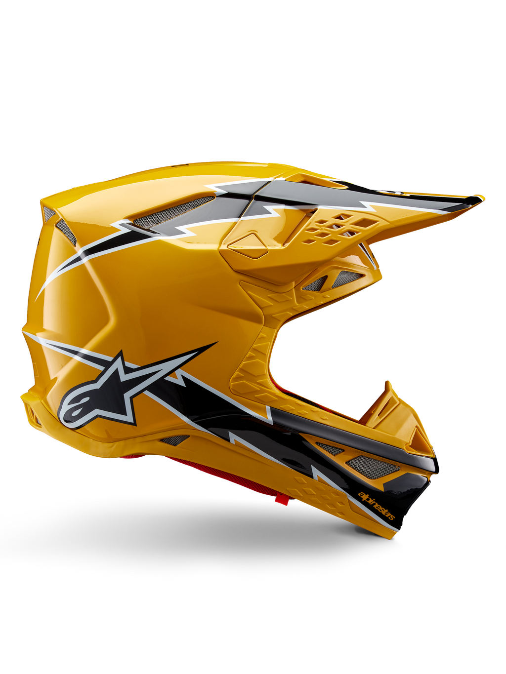 Capacete Alpinestars Supertech M10 Ampress, capacete de motocross, preto e amarelo brilhante, perfil lateral com gráficos arrojados de relâmpagos em preto e branco, logótipo de estrela da Alpinestars, design aerodinâmico com aberturas de ventilação integradas e viseira ajustável.