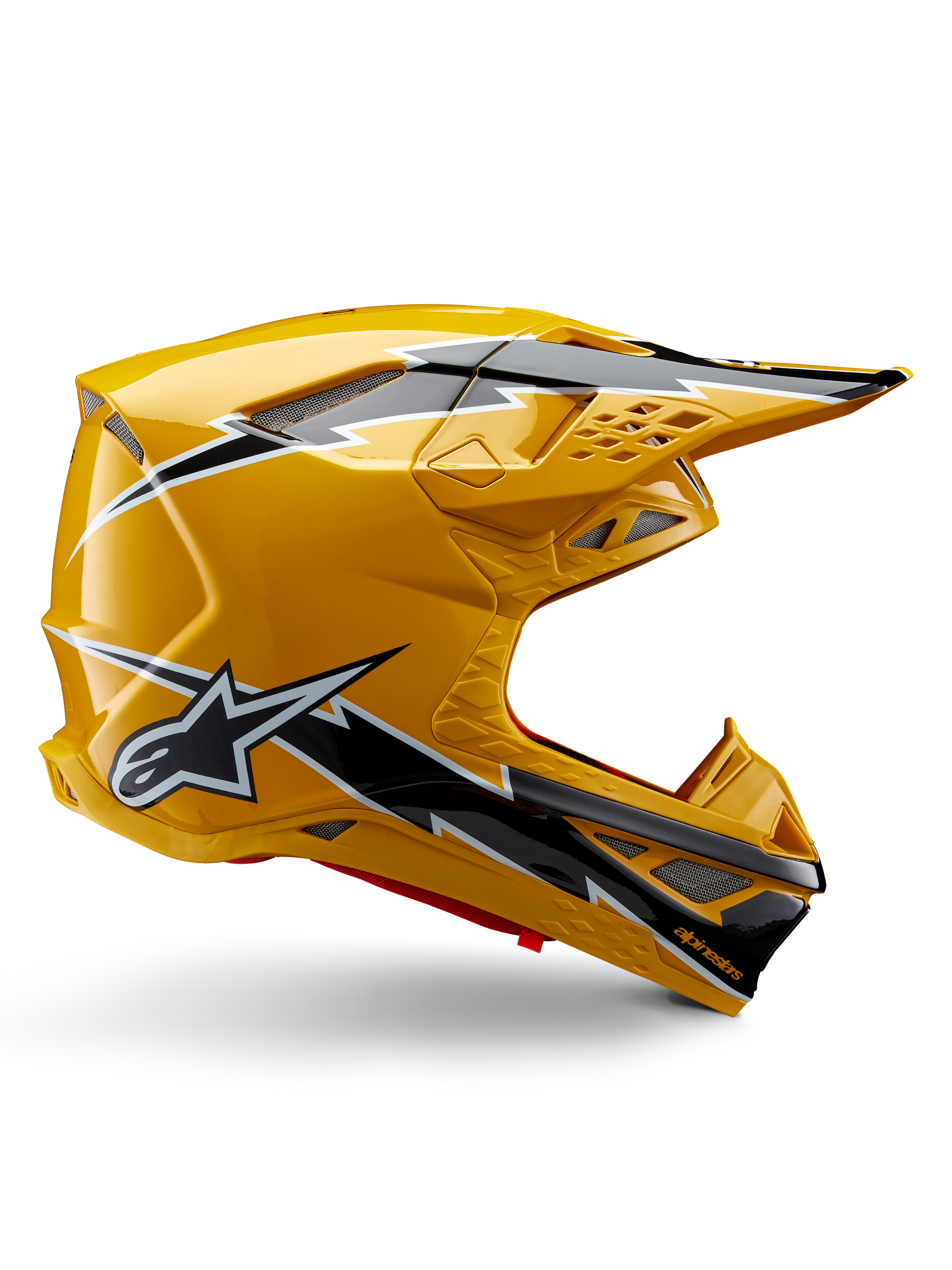 Capacete Alpinestars Supertech M10 Ampress, capacete de motocross, preto e amarelo brilhante, perfil lateral com gráficos arrojados de relâmpagos em preto e branco, logótipo de estrela da Alpinestars, design aerodinâmico com aberturas de ventilação integradas e viseira ajustável.