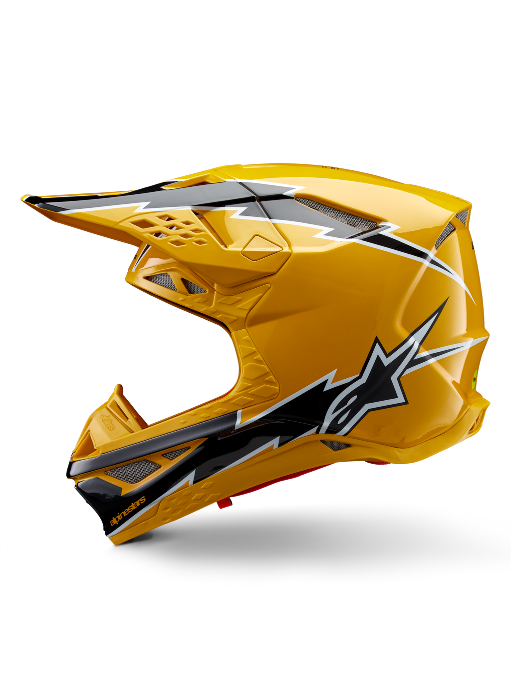 Capacete Alpinestars Supertech M10 Ampress, capacete de motocross, amarelo brilhante com grafismos em preto e branco, vista lateral com designs angulares arrojados, logótipo da estrela Alpinestars e múltiplas aberturas de ventilação com malha prateada, equipamento de corrida profissional para todo-o-terreno