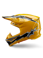 Capacete Alpinestars Supertech M10 Ampress, capacete de motocross, amarelo brilhante com grafismos em preto e branco, vista lateral com designs angulares arrojados, logótipo da estrela Alpinestars e múltiplas aberturas de ventilação com malha prateada, equipamento de corrida profissional para todo-o-terreno