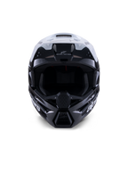 Capacete Alpinestars S-M3 Radium, capacete de motocross, preto, branco e cinzento brilhante, vista frontal, apresentando um design de calota agressivo com viseira branca, queixeira preta e aberturas de ventilação com revestimento em malha.