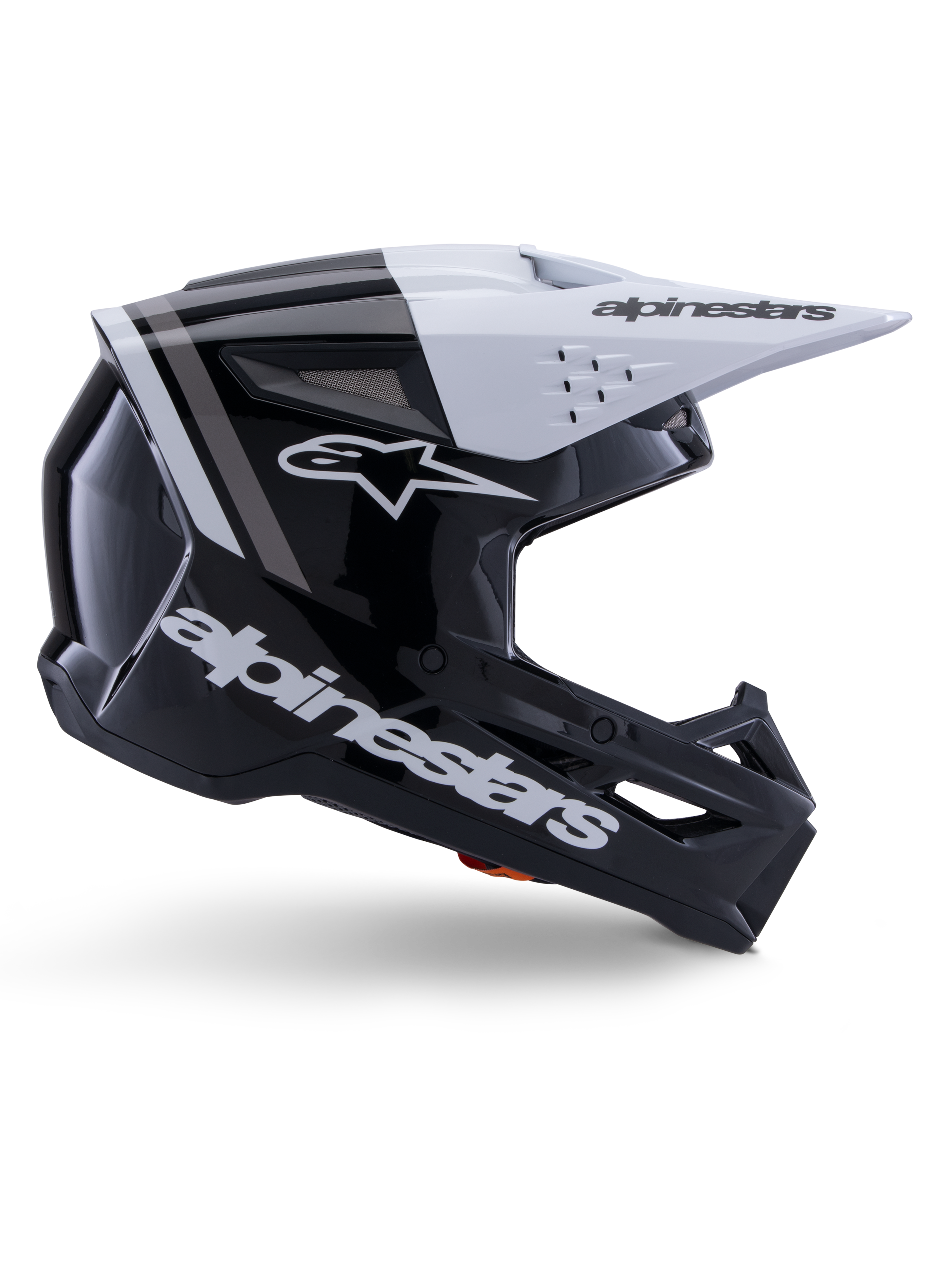 Capacete Alpinestars S-M3 Radium, capacete de motocross off-road, preto, branco e cinzento brilhante, com design aerodinâmico angular e aberturas de ventilação, vista de perfil lateral, acabamento brilhante com riscas cinzentas e viseira branca com logótipo Alpinestars