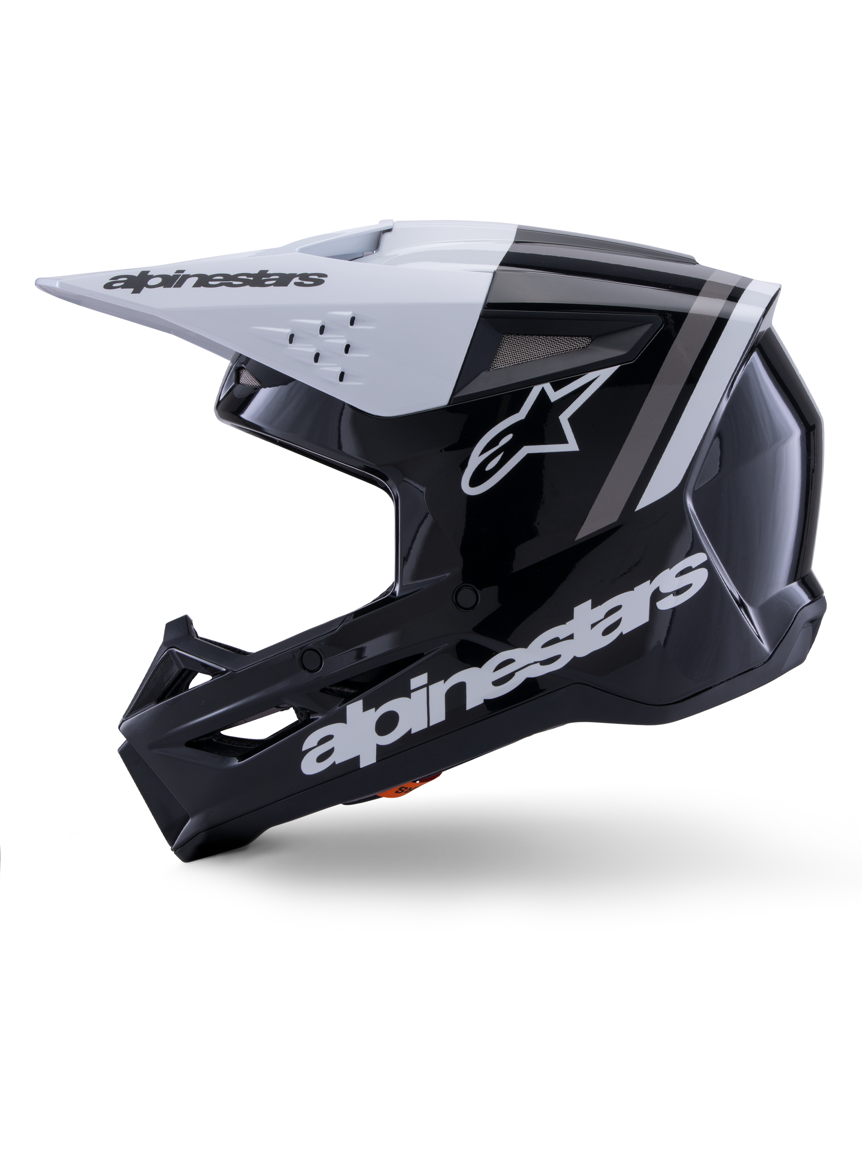 Capacete Alpinestars S-M3 Radium ECE 22.06, vista de perfil lateral, acabamento brilhante em preto e branco, riscas de corrida cinzentas, logótipo Alpinestars branco na lateral e na zona do queixo, design ventilado para motocross e enduro