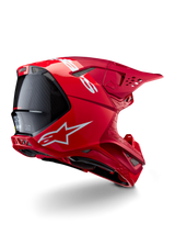 Capacete Alpinestars Supertech M10 Flood, capacete de motocross, vermelho e vermelho fluo, acabamento mate e brilhante, vista de perfil traseiro com logótipo Alpinestars branco e pormenores em fibra de carbono, design aerodinâmico com múltiplas aberturas de ventilação, proteção de cabeça de alta performance para off-road