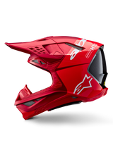 Capacete Alpinestars Supertech M10 Flood ECE 22.06, capacete de motocross, vermelho e vermelho fluo com acabamento mate e brilhante, vista de perfil lateral realçando o design aerodinâmico da calota, múltiplas aberturas de ventilação e logótipo Alpinestars em branco