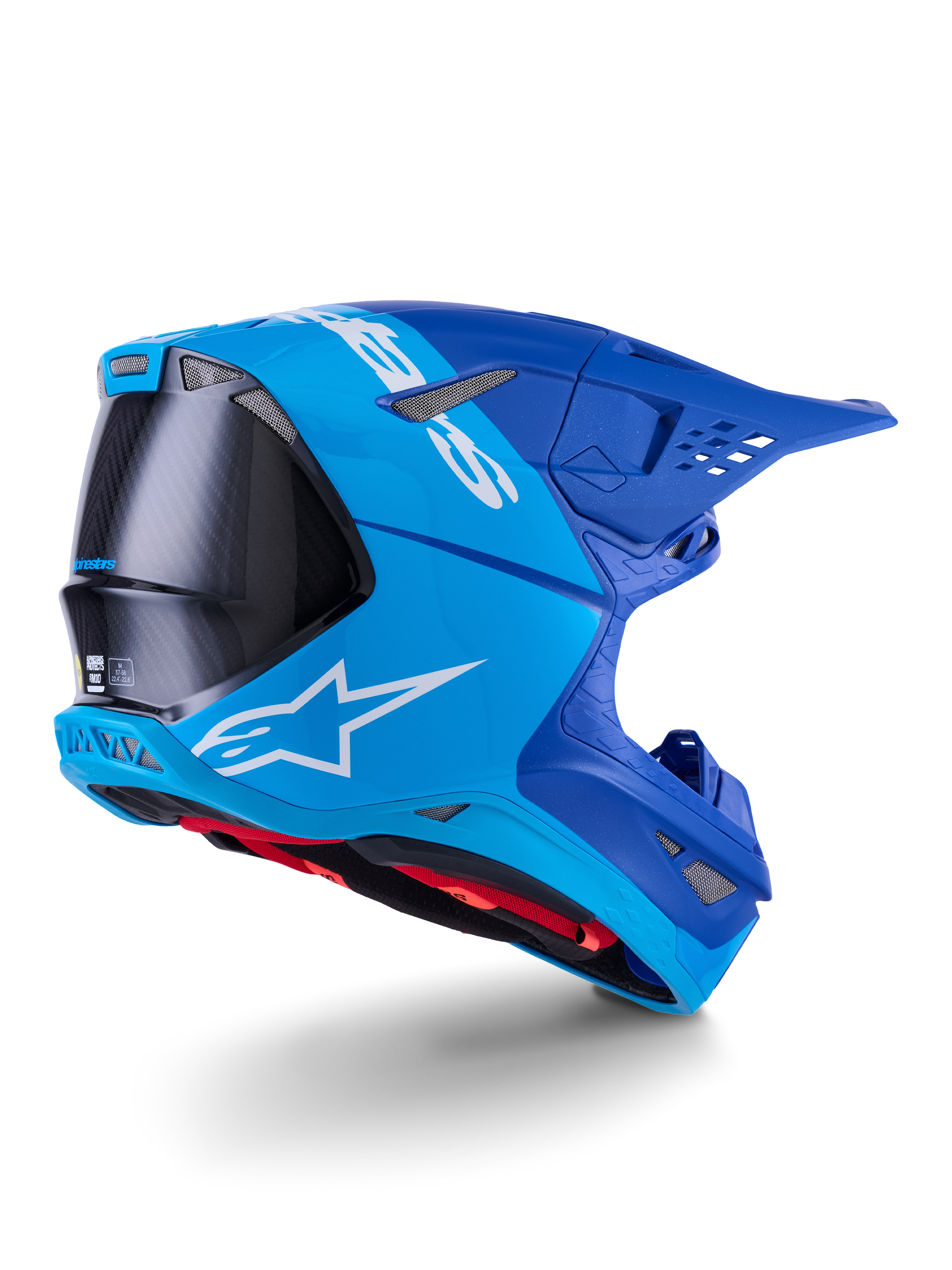 Alpinestars Supertech M10 Flood Helmet, capacete de motocross, azul brilhante e azul marinho com fibra de carbono preta exposta, perfil lateral traseiro com aberturas de ventilação e logótipo branco, forro interior vermelho, design aerodinâmico avançado para performance off-road