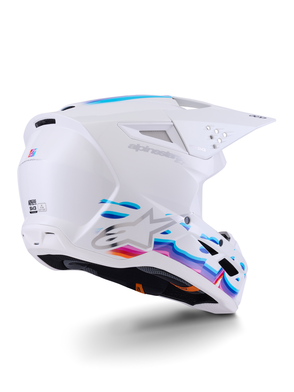 Capacete Alpinestars S-M3 Force OCD, capacete de motocross, branco brilhante com grafismos fluidos em azul e roxo vibrantes, com logótipo Astar prateado e entradas de ventilação laterais, design de calota aerodinâmico para corridas off-road