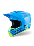 Capacete Alpinestars S-M3 Force OCD, capacete de motocross, ciano brilhante com gráficos ondulados em amarelo néon e roxo, acabamento de alto brilho com logótipo Alpinestars proeminente, concebido para proteção contra impactos em todo-o-terreno e ventilação