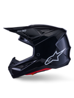 Capacete Alpinestars S-M7 Solid, capacete de motocross em preto brilhante, perfil lateral com logótipo Alpinestars branco, calota aerodinâmica com rede de ventilação e forro interior vermelho, proteção avançada para todo-o-terreno