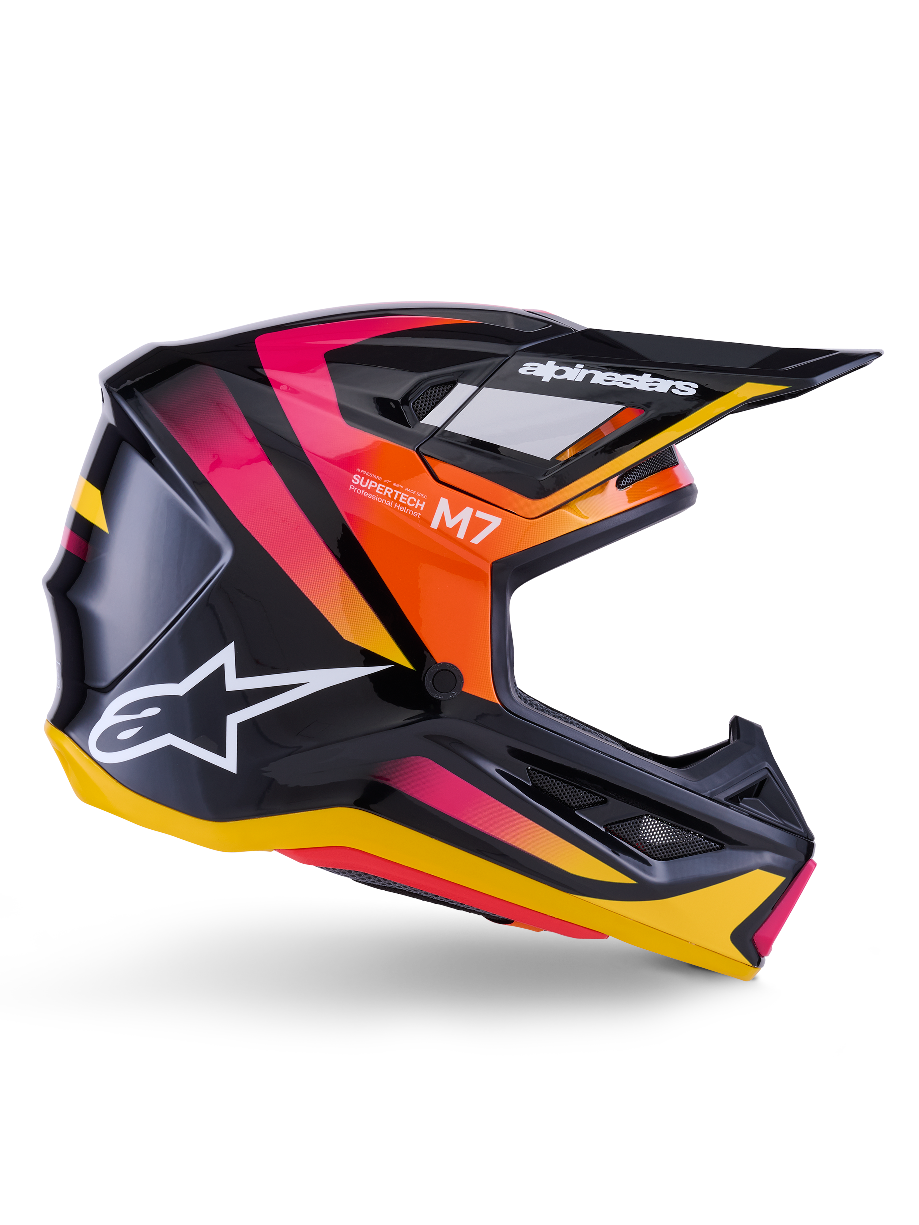Capacete Alpinestars S-M7 Rise, capacete de motocross, preto brilhante com grafismos em rosa, laranja e amarelo, vista de perfil lateral, com logótipo Alpinestars e viseira em branco, calota aerodinâmica com aberturas de ventilação integradas.
