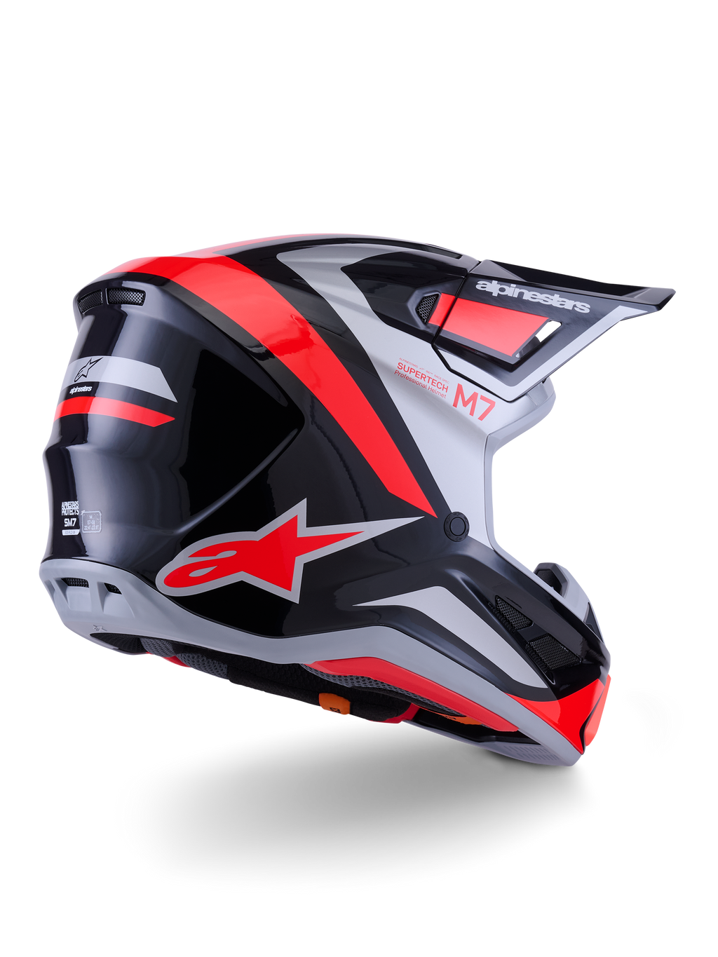 Capacete Alpinestars S-M7 Rise, capacete de motocross, preto, prateado e vermelho fluo brilhante, vista traseira em três quartos, com logótipo A-star vermelho em destaque e detalhes prateados, calota aerodinâmica com viseira, proteção profissional para corridas todo-o-terreno