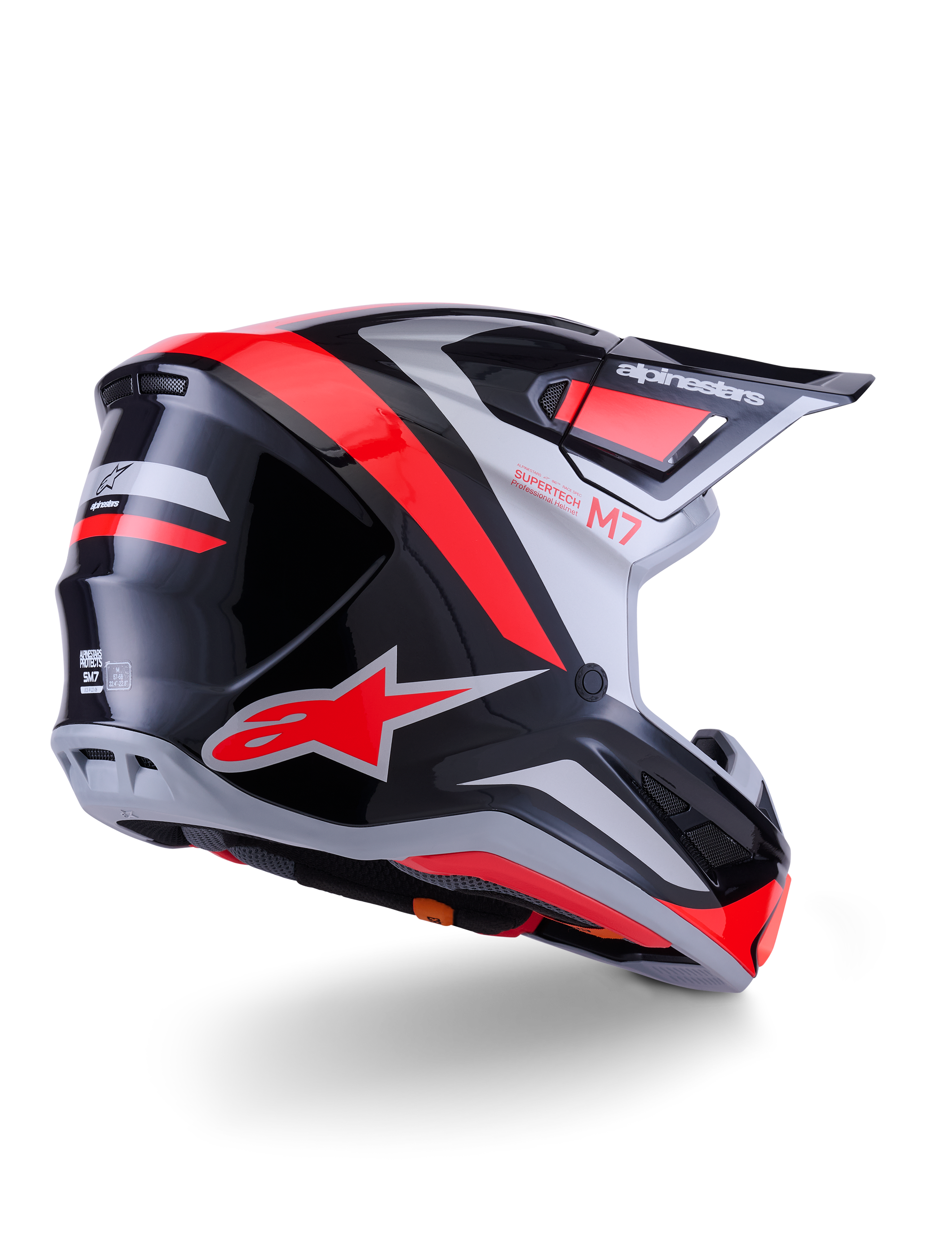 Capacete Alpinestars S-M7 Rise, capacete de motocross, preto, prateado e vermelho fluo brilhante, vista traseira em três quartos, com logótipo A-star vermelho em destaque e detalhes prateados, calota aerodinâmica com viseira, proteção profissional para corridas todo-o-terreno