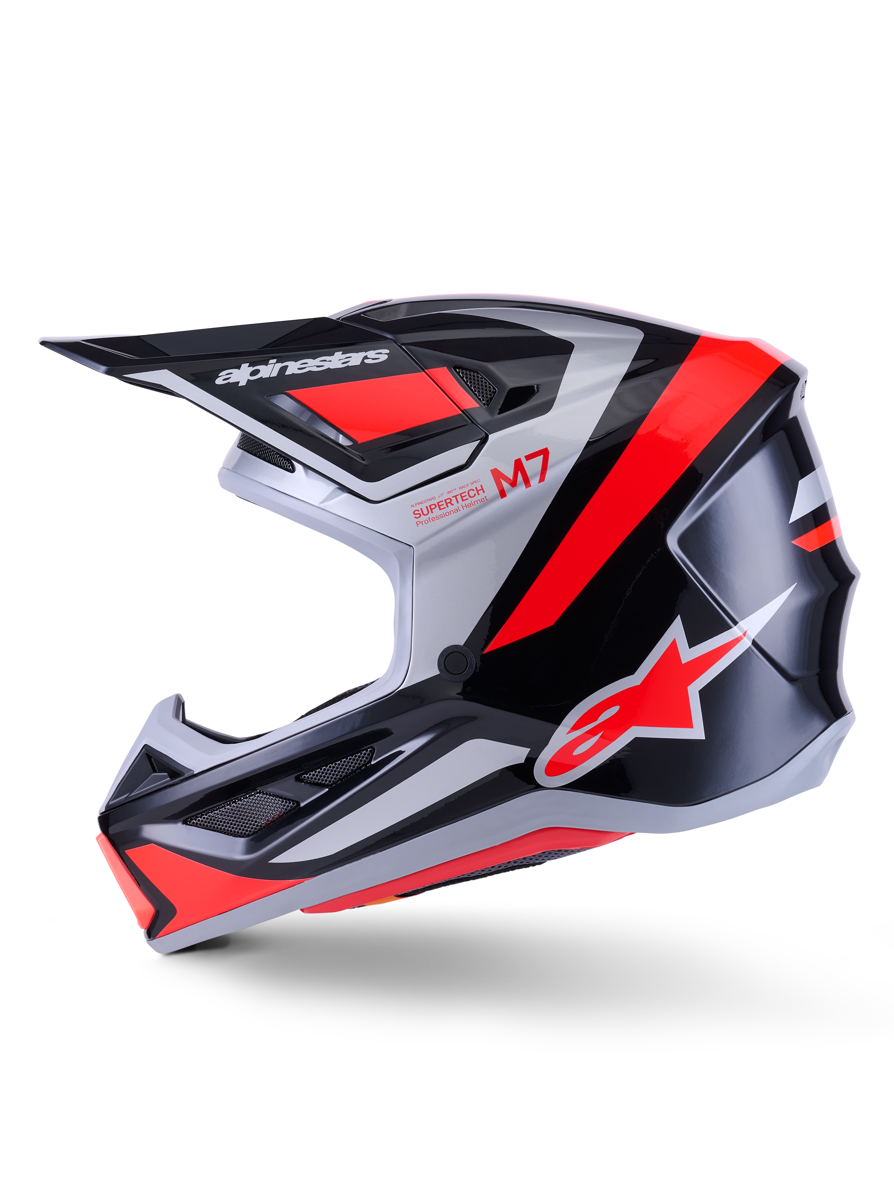 Capacete Alpinestars S-M7 Rise, capacete de motocross, preto, prateado e vermelho fluo brilhante, vista de perfil lateral com calota composta aerodinâmica, proteção de queixo ventilada e pala proeminente com a marca Alpinestars
