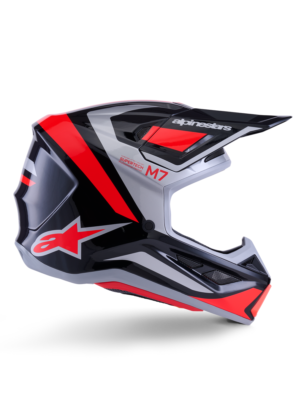 Alpinestars S-M7 Rise Helmet, capacete de motocross, preto, prateado e vermelho fluorescente, vista lateral com design aerodinâmico angular, pala e aberturas de ventilação, acabamento brilhante, série Supertech M7