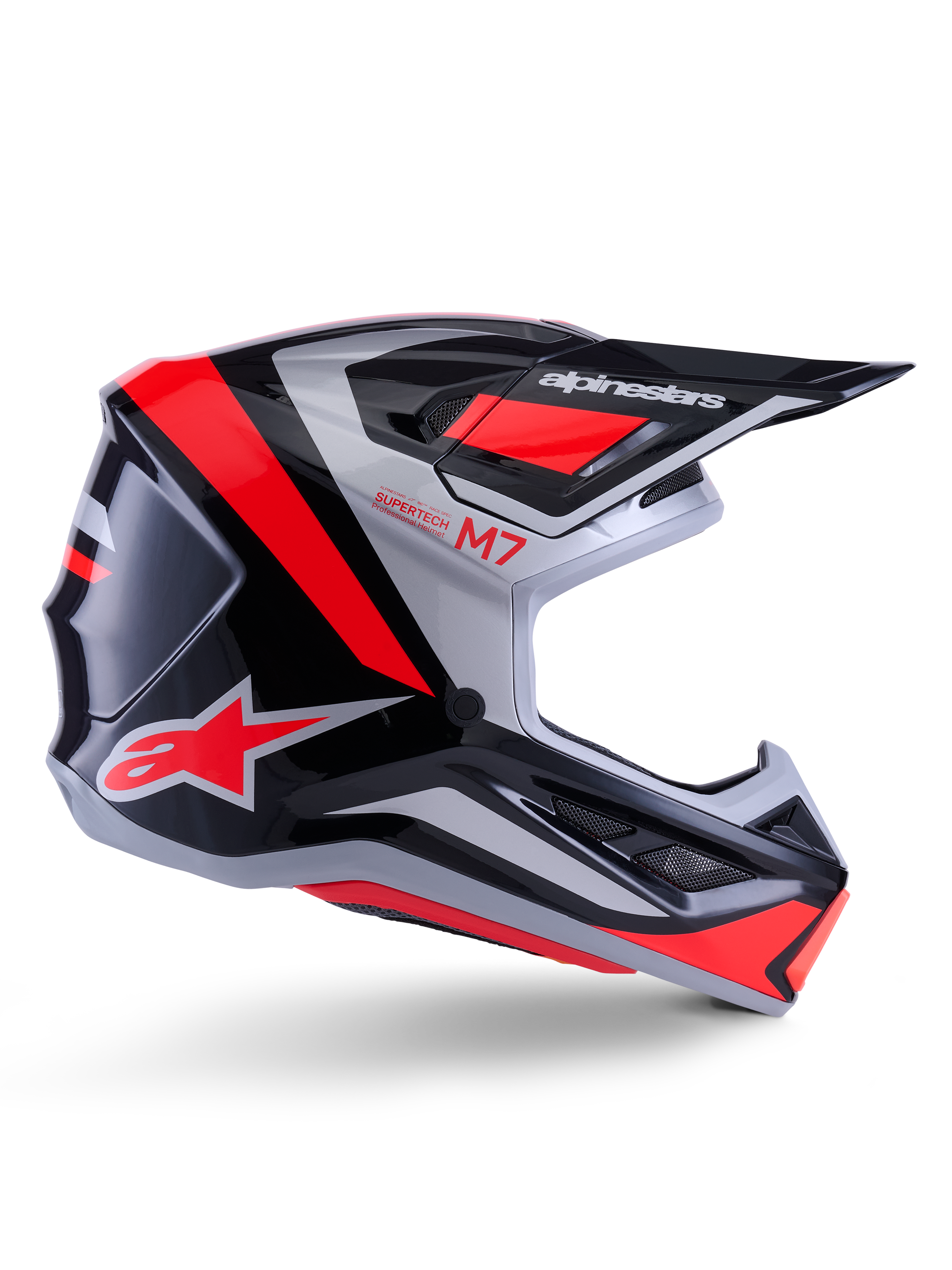 Alpinestars S-M7 Rise Helmet, capacete de motocross, preto, prateado e vermelho fluorescente, vista lateral com design aerodinâmico angular, pala e aberturas de ventilação, acabamento brilhante, série Supertech M7