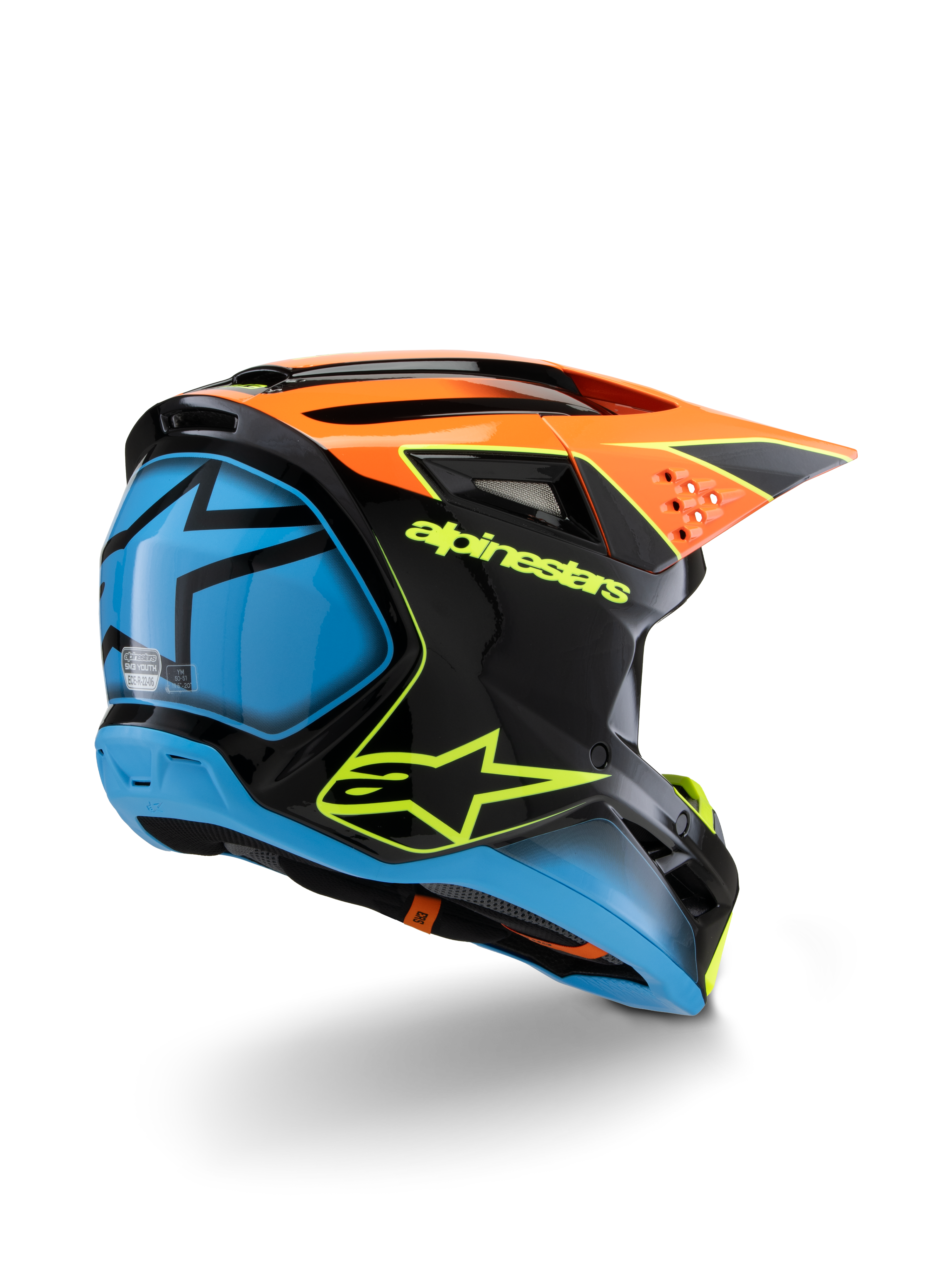 Capacete Alpinestars S-M3 Youth Fray, capacete de motocross, preto, cor-de-laranja e azul com pormenores em amarelo néon, vista traseira de três quartos realçando a marca Alpinestars e o logótipo da estrela, design aerodinâmico para competições off-road juvenis