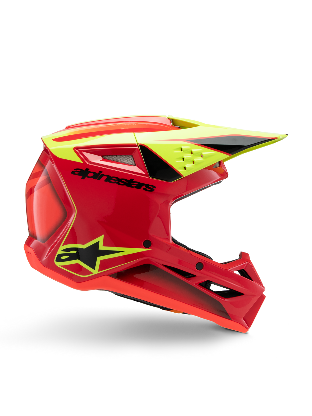Capacete Alpinestars S-M3 Youth Fray, capacete de motocross, vermelho, amarelo néon e preto brilhante, vista de perfil lateral exibindo um design aerodinâmico elegante com viseira integrada e aberturas de ventilação proeminentes, logótipo preto sobre uma calota vermelha vibrante, otimizado para desempenho off-road de jovens pilotos