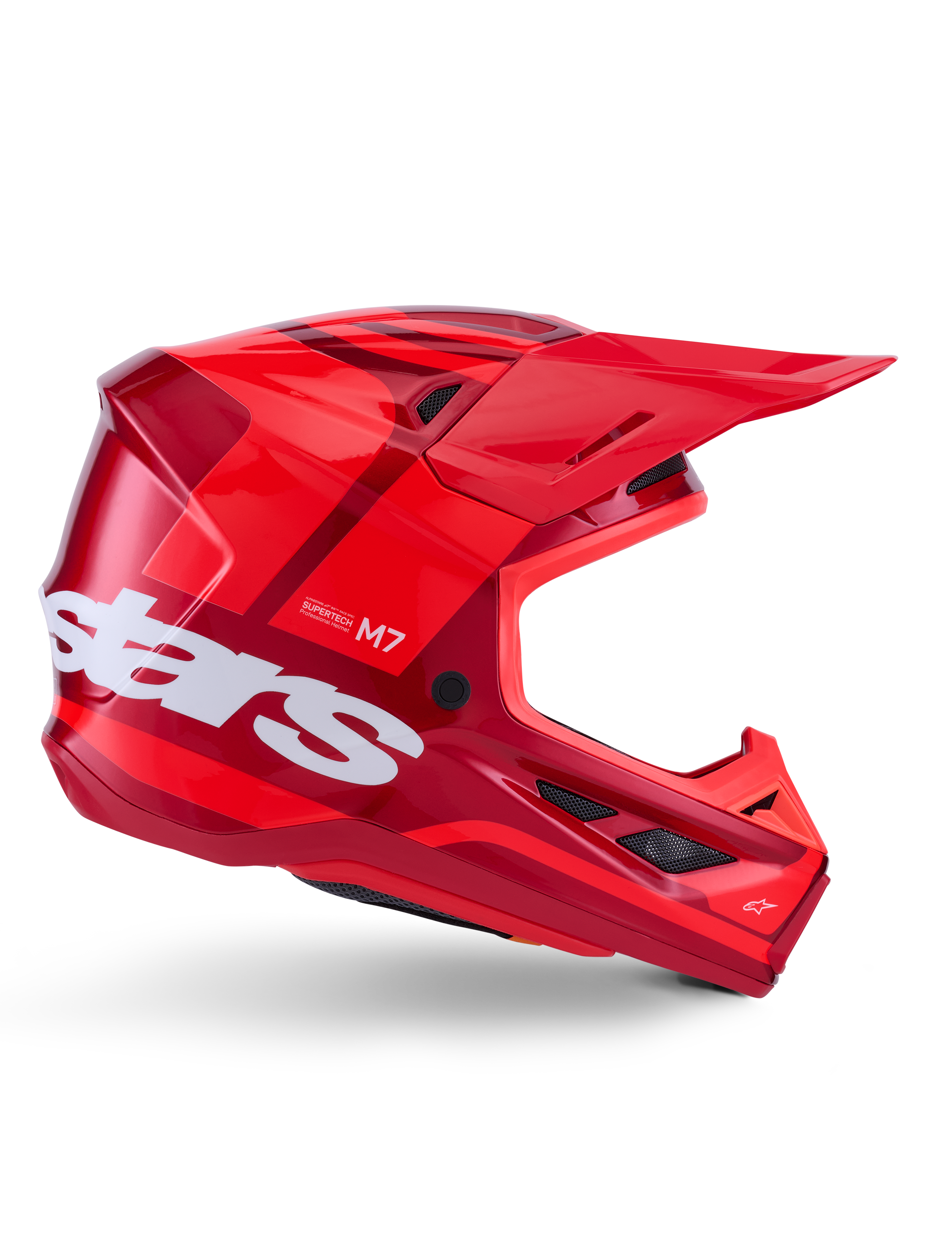Alpinestars S-M7 Core Helmet, capacete de motocross, vermelho brilhante com detalhes em vermelho escuro e logótipos brancos, vista lateral com o grande logótipo stars em branco, calota aerodinâmica com aberturas de ventilação em malha e uma viseira proeminente