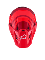 Alpinestars S-M7 Core Helmet, Red Glossy, top-down view featuring aerodynamic shell with darker red accents, white A-star logo on the visor, integrated ventilation ports, high-performance motocross protective gear