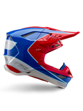 Capacete Alpinestars Supertech M10 Aeon, capacete de corrida de motocross, vermelho vivo, azul e branco, acabamento brilhante, perfil lateral aerodinâmico com múltiplas aberturas de ventilação cobertas por malha, contornos angulares e pala