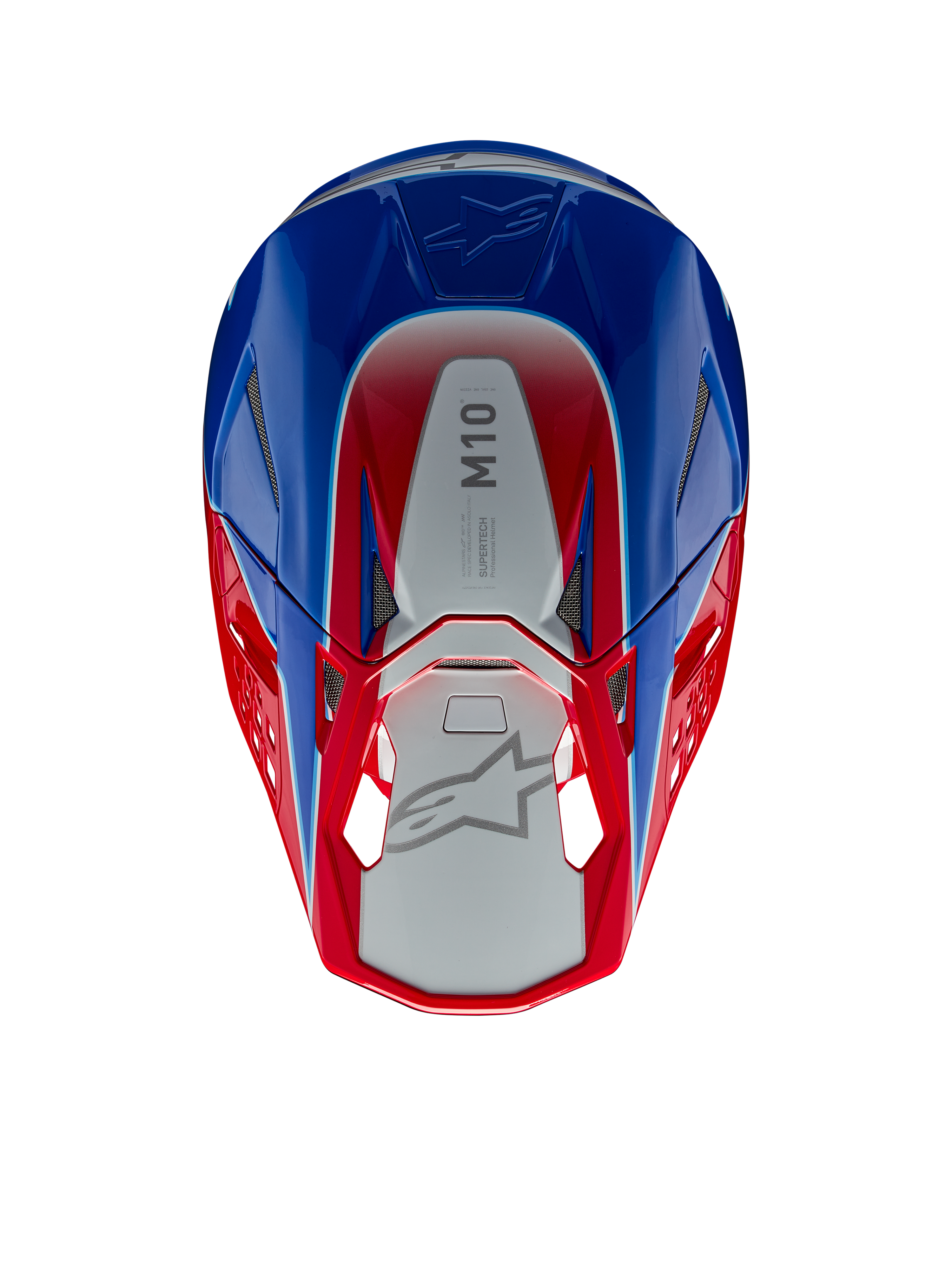 Capacete Alpinestars Supertech M10 Aeon, capacete de motocross, vermelho e azul brilhante, vista superior mostrando o painel central prateado com a marca M10, calota aerodinâmica com detalhes em vermelho e azul, aberturas de ventilação em malha, proteção de cabeça de alta performance para motocross