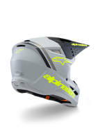 Alpinestars S-M3 Youth Radium Helmet ECE 22.06, capacete de motocross, cinzento, preto e amarelo fluorescente mate, vista traseira de três quartos mostrando a marca amarela e o logótipo de estrela, calota aerodinâmica com ventilação para condução todo-o-terreno
