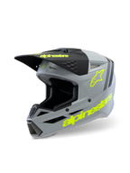 Alpinestars S-M3 Youth Radium Helmet ECE 22.06, capacete de motocross, cinzento mate e preto com detalhes em amarelo fluorescente, com marca Alpinestars e logótipo de estrela em destaque, equipamento de proteção para todo-o-terreno para jovens