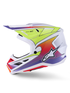 Capacete Alpinestars S-M7 Fuse, capacete de motocross, branco, amarelo néon e roxo brilhante, vista de perfil lateral exibindo a calota aerodinâmica com gráficos de gradiente colorido, entradas de ventilação pretas e logótipo Alpinestars branco, equipamento de competição off-road de alto desempenho.