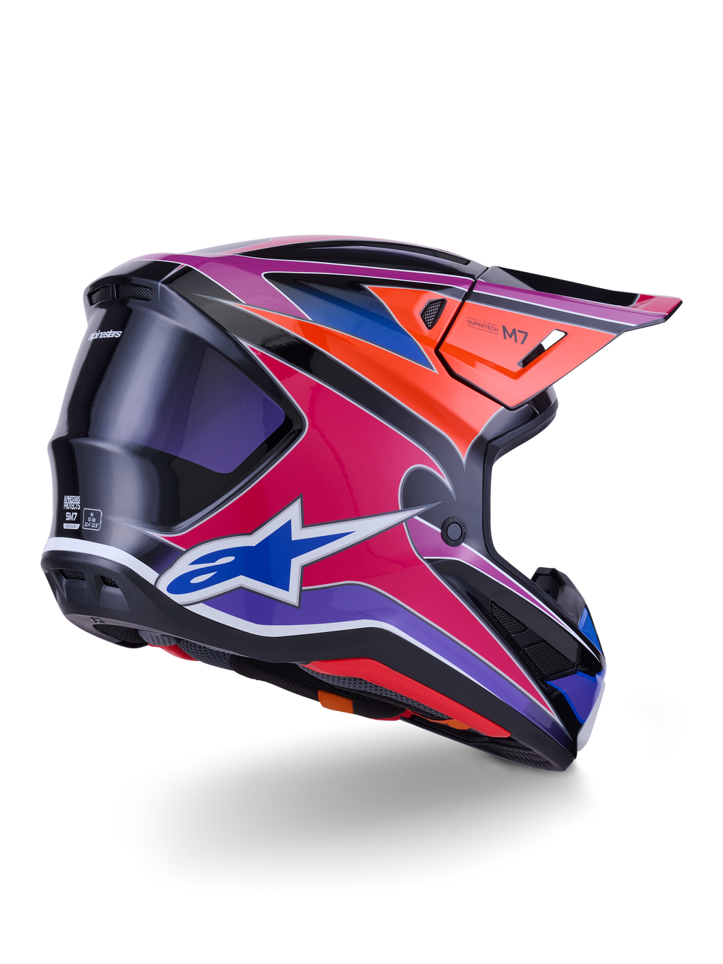Alpinestars S-M7 Fuse Helmet, Motocross Helmet, Blue Purple and Pink Glossy finish with orange and black accents, rear three-quarter view showing the aerodynamic shell, visor, and ventilation ports, professional off-road racing protection