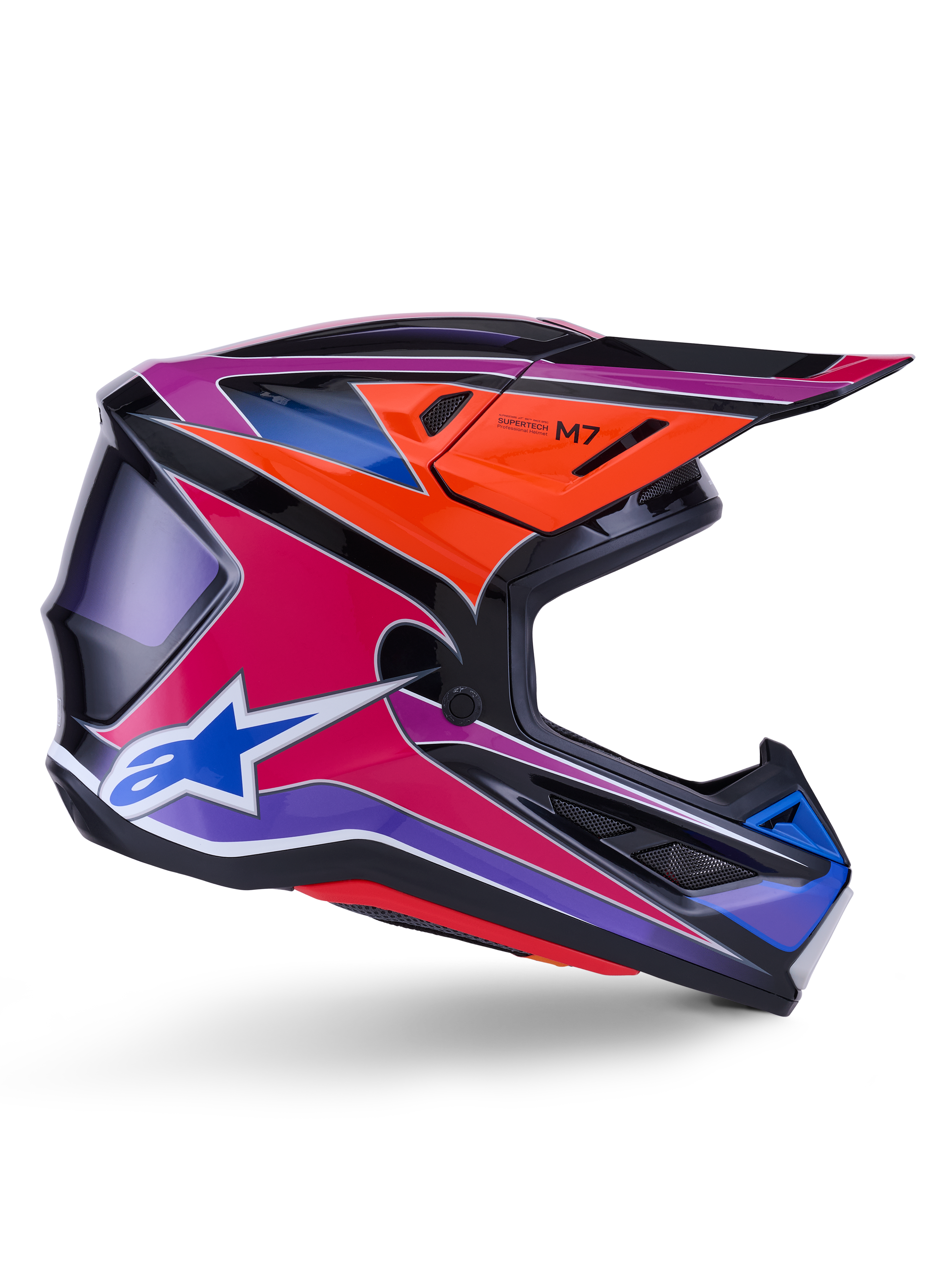 Capacete Alpinestars S-M7 Fuse, capacete de motocross, azul, roxo e rosa brilhante, vista de perfil lateral com gráficos de corrida vibrantes, design de concha aerodinâmica com aberturas de ventilação e logótipo de estrela Alpinestars