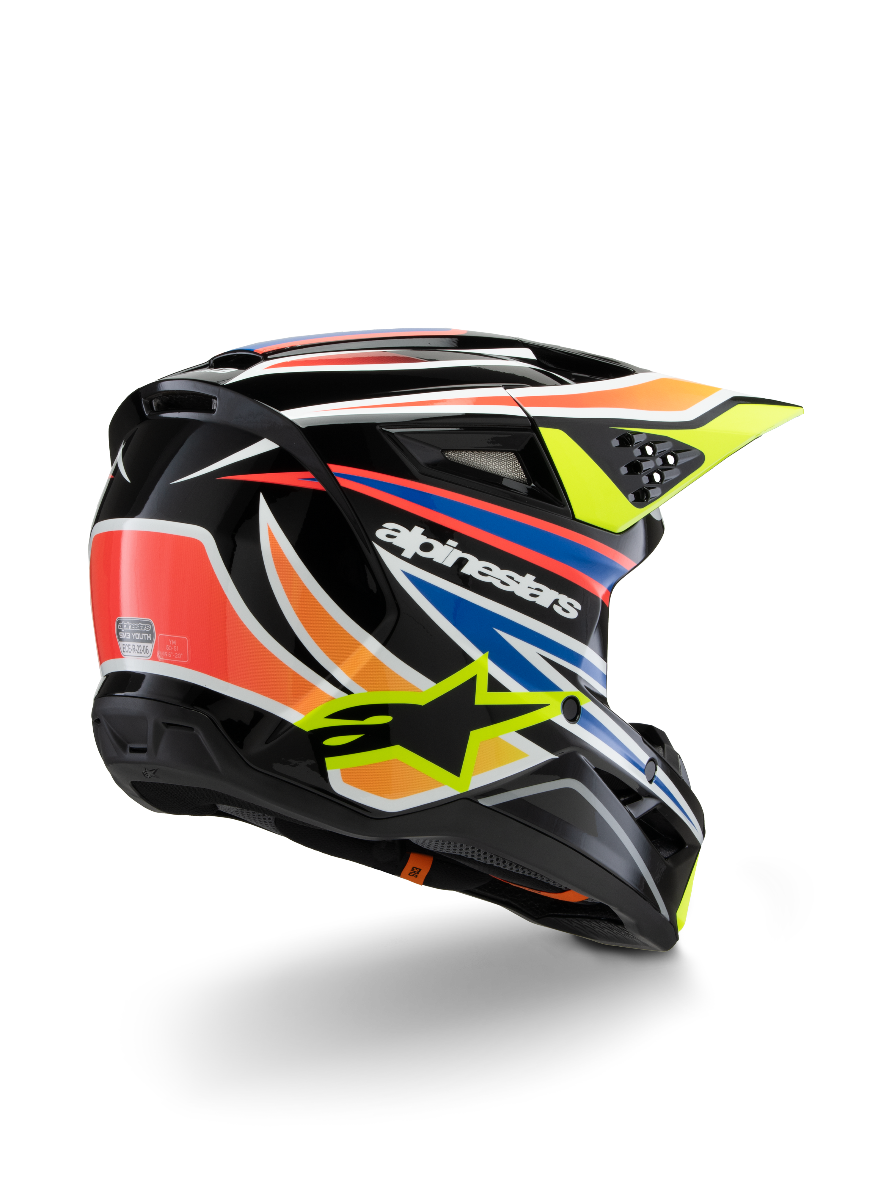 Capacete Alpinestars S-M3 Youth Wurx, capacete de motocross para jovens, preto com detalhes em laranja vibrante, vermelho, azul e amarelo fluorescente, vista traseira em três quartos mostrando a calota aerodinâmica e as aberturas de ventilação, acabamento brilhante com logótipos Alpinestars em destaque.