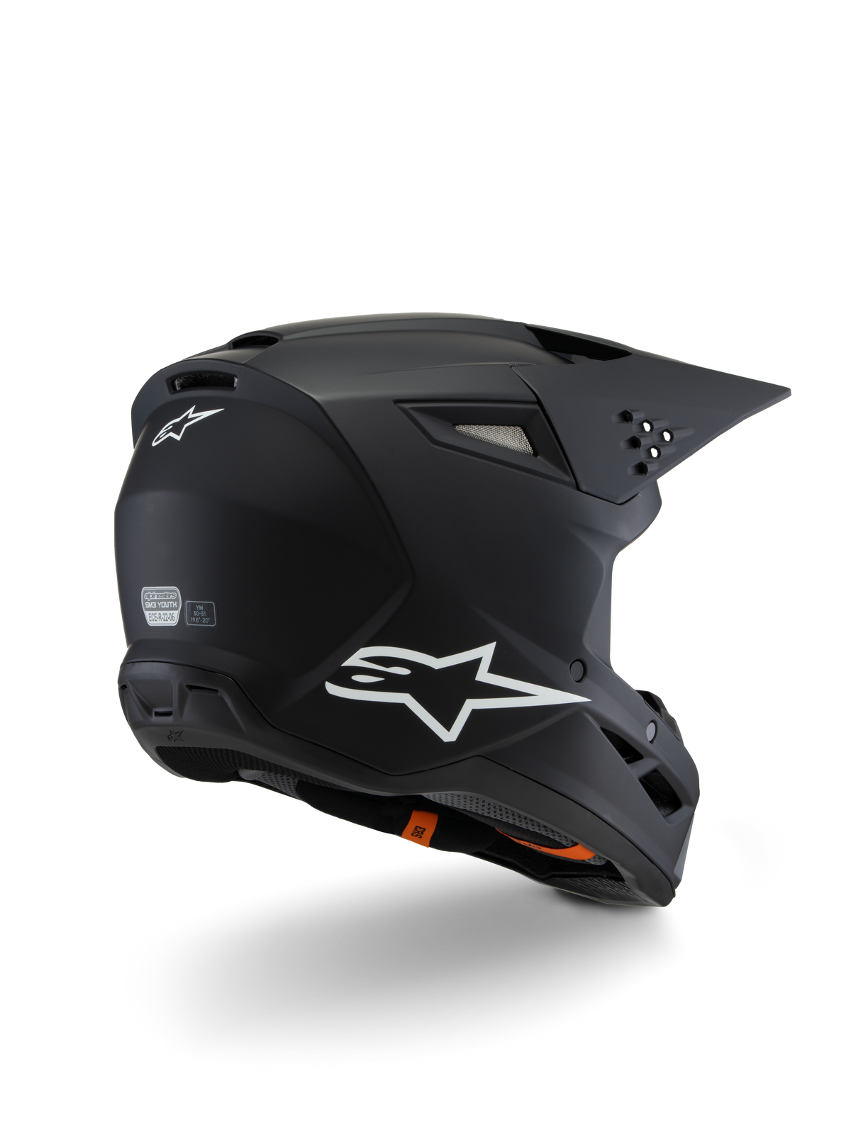 Alpinestars S-M3 Jovem Solid Helmet ECE 22.06, capacete de motocross, preto mate, vista traseira de três quartos com logótipos Alpinestars brancos, design de concha elegante com viseira integrada e aberturas de ventilação, equipamento de proteção para todo-o-terreno para jovens