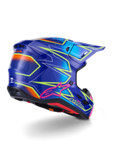 Capacete Alpinestars S-M7 Cast, capacete de motocross, azul, cor-de-rosa e amarelo néon brilhante, vista de três quartos traseira exibindo o casco aerodinâmico com gráficos angulares marcantes, logótipo Astar cor-de-rosa e aberturas de ventilação integradas para corridas off-road