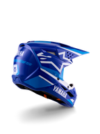 Capacete de motocross Alpinestars Yamaha S-M3 para jovens, azul e branco brilhante, com a marca Yamaha em destaque na lateral e na parte traseira, design aerodinâmico com ventilação posterior, proteção de cabeça para todo-o-terreno numa vista traseira de três quartos